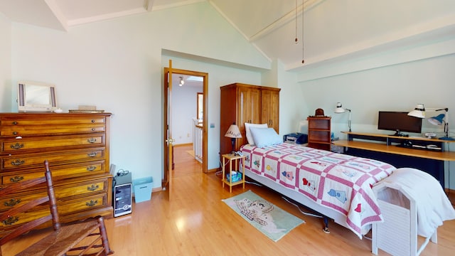 11 Beethoven Ln, Enfield, ME 04493 - bedroom with attic access, light wood-style floors, high vaulted ceiling, and baseboards