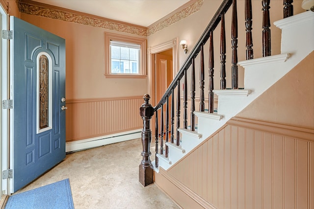 77 Cottage St, Bangor, ME 04401 - entrance foyer with wainscoting, a baseboard heating unit, stairs, and a decorative wall