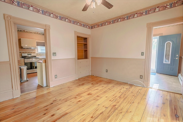 77 Cottage St, Bangor, ME 04401 - spare room featuring wainscoting, wood-type flooring, and ceiling fan