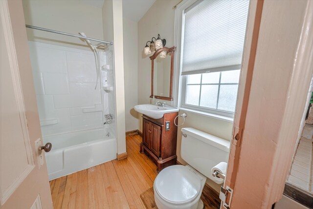 77 Cottage St, Bangor, ME 04401 - full bath featuring hardwood / wood-style flooring, toilet, vanity, and bathtub / shower combination