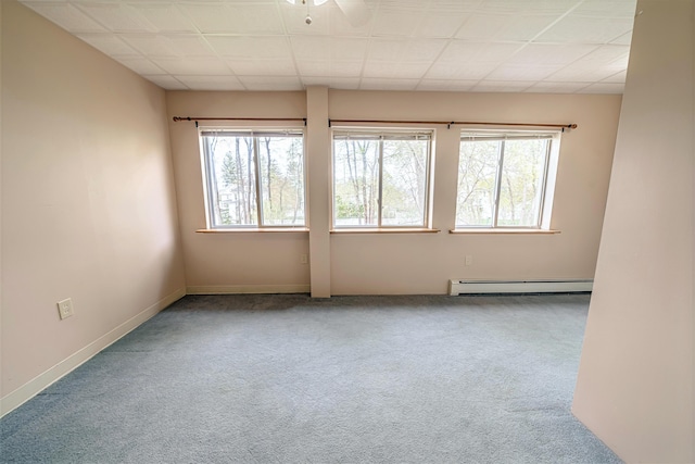 77 Cottage St, Bangor, ME 04401 - empty room with a baseboard heating unit, plenty of natural light, carpet floors, and baseboards