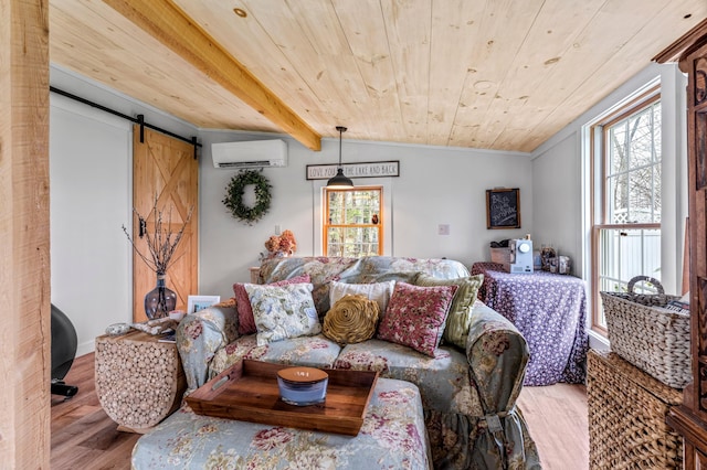 living room featuring a wall mounted air conditioner, a barn door, wood ceiling, wood finished floors, and ornamental molding