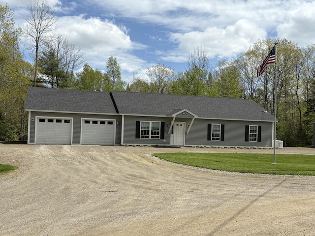 38 Deer Ridge Ln, Windsor, ME 04363 - ranch-style house with dirt driveway, an attached garage, a front lawn, and central AC unit