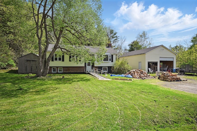 5 Skyline Dr, Chelsea, ME 04330 - view of front of home featuring a garage, a front yard, and a chimney