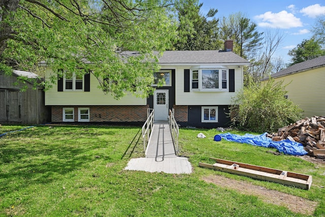5 Skyline Dr, Chelsea, ME 04330 - split foyer home with a chimney and a front yard