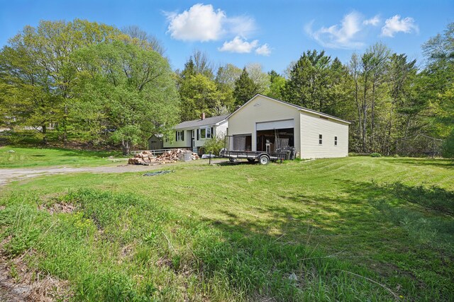 5 Skyline Dr, Chelsea, ME 04330 - back of house featuring an outbuilding and a lawn