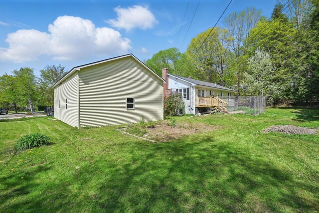 5 Skyline Dr, Chelsea, ME 04330 - view of side of property with a yard and a deck