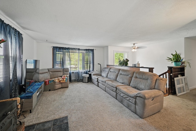 5 Skyline Dr, Chelsea, ME 04330 - carpeted living area with a textured ceiling and a ceiling fan