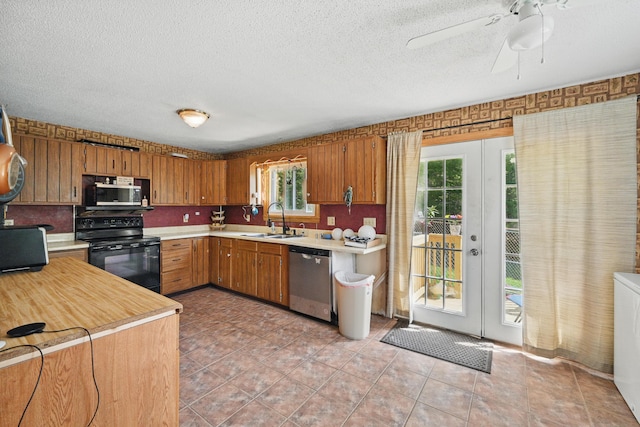 5 Skyline Dr, Chelsea, ME 04330 - kitchen featuring stainless steel appliances, a sink, light countertops, french doors, and a textured ceiling