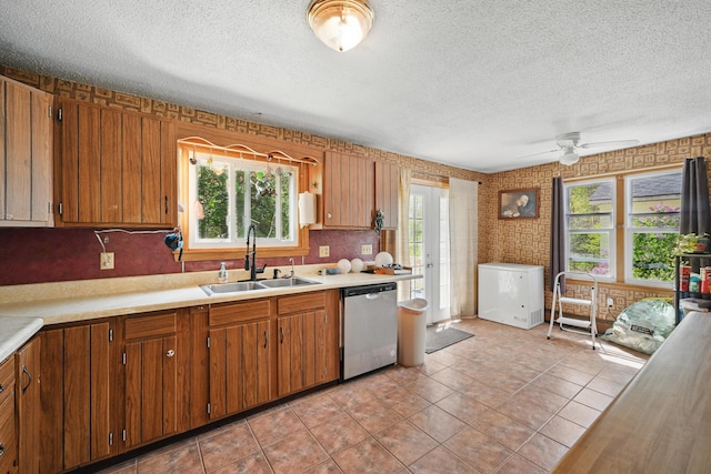 5 Skyline Dr, Chelsea, ME 04330 - kitchen featuring stainless steel dishwasher, a sink, a textured ceiling, light countertops, and ceiling fan