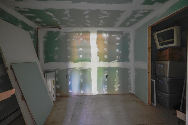 5 Skyline Dr, Chelsea, ME 04330 - unfurnished room with a baseboard radiator and concrete flooring