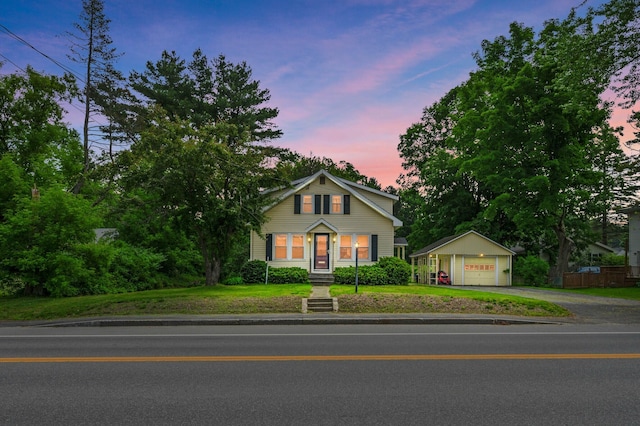 148 Water St, Randolph, ME 04346 - view of front facade with an outbuilding, a garage, and driveway