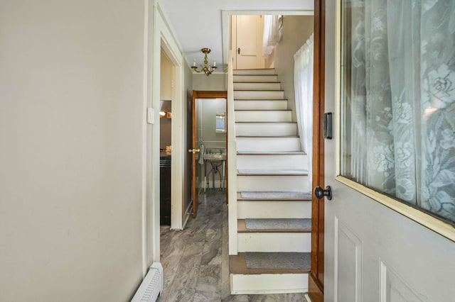 148 Water St, Randolph, ME 04346 - stairway featuring a chandelier and marble finish flooring