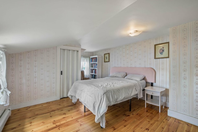148 Water St, Randolph, ME 04346 - bedroom featuring hardwood / wood-style floors, lofted ceiling, and baseboard heating