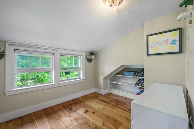 148 Water St, Randolph, ME 04346 - bedroom with baseboards, light wood-style floors, and lofted ceiling