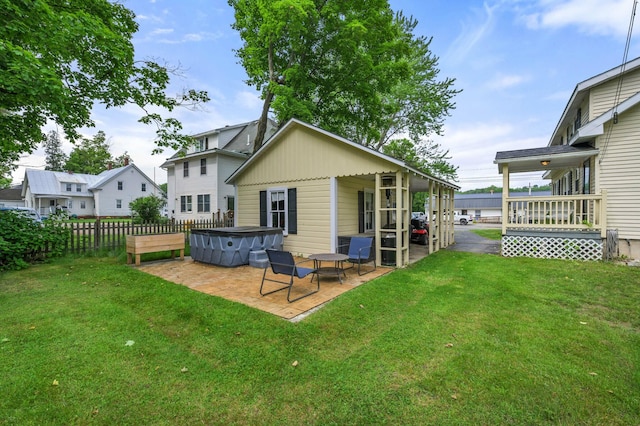 148 Water St, Randolph, ME 04346 - back of house with a hot tub and a patio