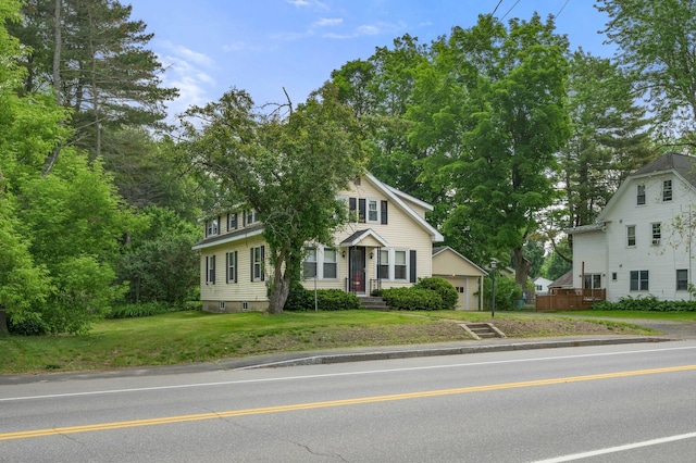 148 Water St, Randolph, ME 04346 - view of front facade with a front yard and view of wooded area