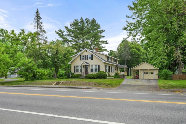 148 Water St, Randolph, ME 04346 - traditional-style home with a garage, an outdoor structure, a chimney, and driveway