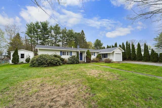 42 Sugarloaf Ln, Bangor, ME 04401 - ranch-style home featuring asphalt driveway, an attached garage, a front lawn, and a chimney