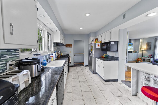 42 Sugarloaf Ln, Bangor, ME 04401 - kitchen with black appliances, a sink, dark countertops, white cabinets, and light marble finish flooring