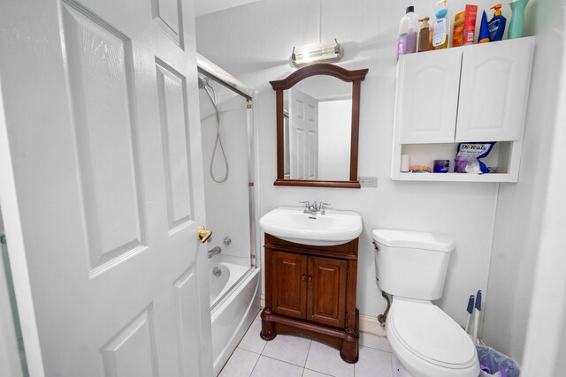 42 Sugarloaf Ln, Bangor, ME 04401 - full bath with tile patterned floors, toilet, vanity, and shower / bath combination