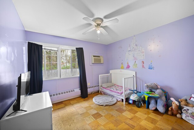 42 Sugarloaf Ln, Bangor, ME 04401 - bedroom featuring a wall mounted air conditioner, a baseboard radiator, and a ceiling fan