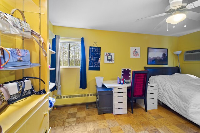 42 Sugarloaf Ln, Bangor, ME 04401 - bedroom with baseboard heating, a ceiling fan, and a wall unit AC
