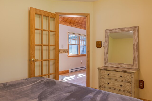 139 Havey Point Rd, Hancock, ME 04640 - bedroom featuring a baseboard radiator and wood finished floors