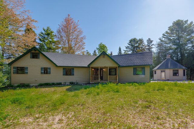 139 Havey Point Rd, Hancock, ME 04640 - view of front of house featuring a front lawn and a shingled roof