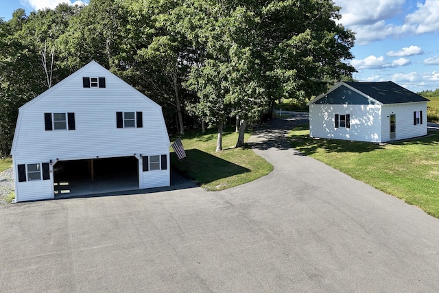 5 Polka Valley Rd, Sedgwick, ME 04676 - view of side of home featuring a yard and driveway