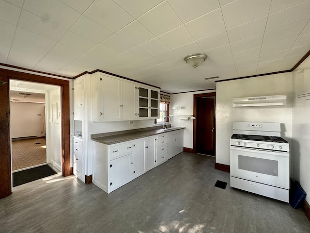 5 Polka Valley Rd, Sedgwick, ME 04676 - kitchen with white range with gas cooktop, under cabinet range hood, white cabinets, dark countertops, and dark wood-style floors