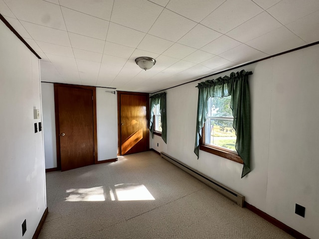 5 Polka Valley Rd, Sedgwick, ME 04676 - unfurnished room with a baseboard heating unit and light colored carpet