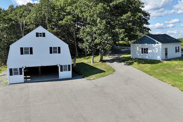 5 Polka Valley Rd, Sedgwick, ME 04676 - view of property exterior with a yard and asphalt driveway