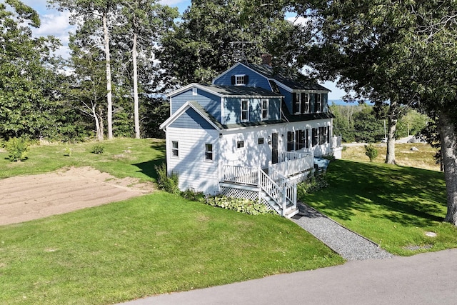 5 Polka Valley Rd, Sedgwick, ME 04676 - view of front of home featuring a chimney, a porch, a front lawn, and driveway