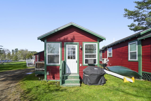 1270 Lakeview Dr Unit 11, China, ME 04358 - view of front of house featuring a front yard, entry steps, and cooling unit