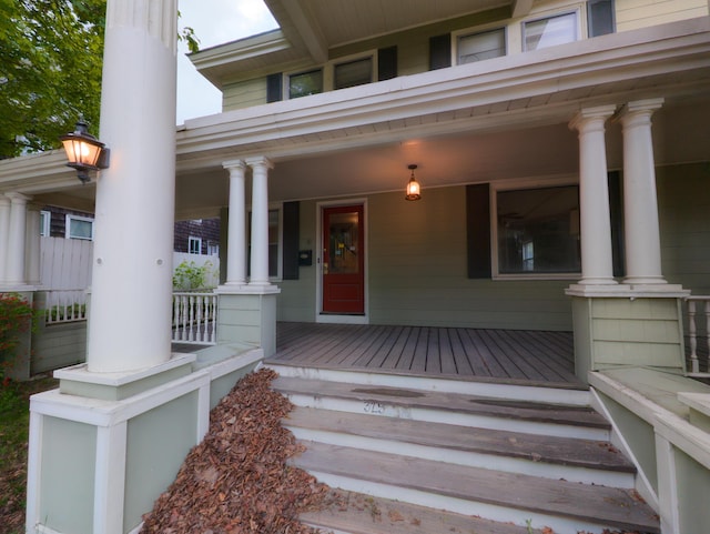 view of exterior entry with covered porch