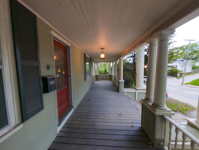 wooden terrace featuring a porch