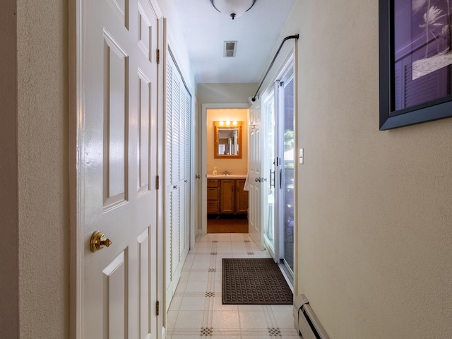 19 Brookside Dr, Falmouth, ME 04105 - corridor featuring light flooring and a baseboard heating unit