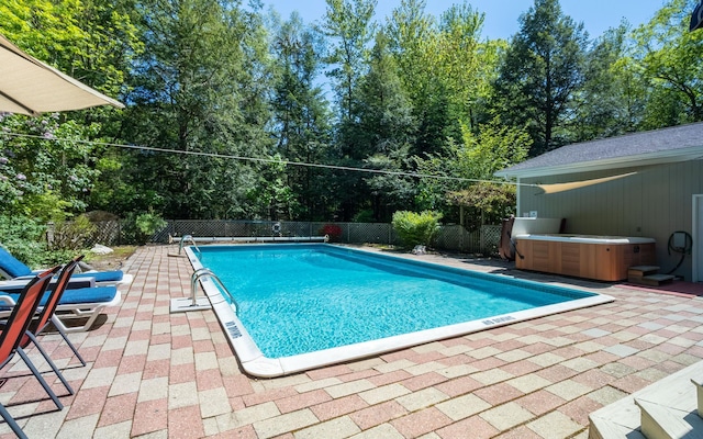 19 Brookside Dr, Falmouth, ME 04105 - view of pool featuring a hot tub, a patio, a fenced backyard, and view of wooded area