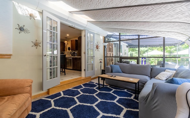 19 Brookside Dr, Falmouth, ME 04105 - sunroom / solarium with french doors and an outdoor hangout area