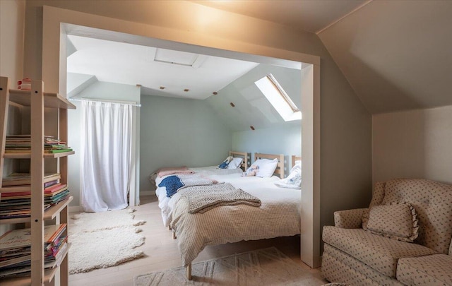 34 Admonten Ave, Rockland, ME 04841 - bedroom featuring vaulted ceiling, wood finished floors, and attic access