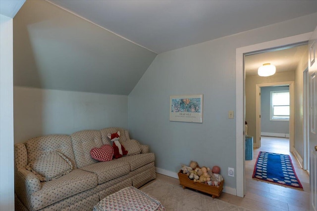 34 Admonten Ave, Rockland, ME 04841 - living room with vaulted ceiling, wood finished floors, and baseboards