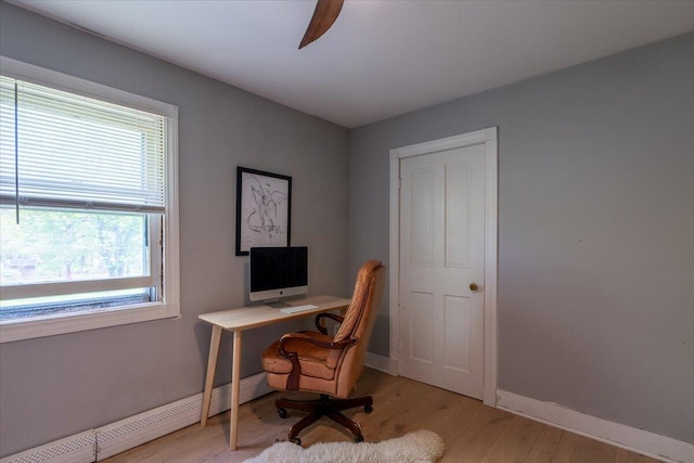 34 Admonten Ave, Rockland, ME 04841 - office with light wood finished floors, baseboards, and a baseboard heating unit