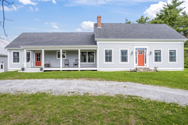 246 Coombs Rd, Brunswick, ME 04011 - view of front of home with a chimney, covered porch, entry steps, a front yard, and a shingled roof
