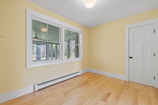 246 Coombs Rd, Brunswick, ME 04011 - empty room with a baseboard radiator, wood finished floors, and baseboards