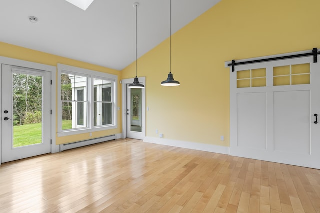 246 Coombs Rd, Brunswick, ME 04011 - unfurnished sunroom featuring a baseboard radiator, a barn door, and lofted ceiling