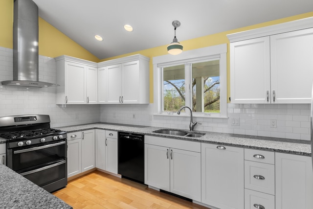 246 Coombs Rd, Brunswick, ME 04011 - kitchen with double oven range, black dishwasher, wall chimney range hood, a sink, and white cabinetry