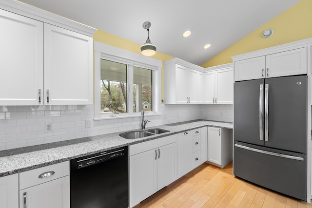 246 Coombs Rd, Brunswick, ME 04011 - kitchen featuring freestanding refrigerator, dishwasher, a sink, white cabinetry, and light wood-style floors