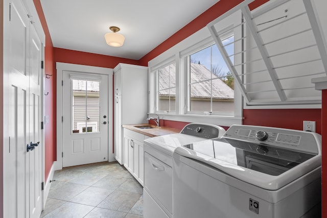 246 Coombs Rd, Brunswick, ME 04011 - laundry room with washer and dryer, cabinet space, and light tile patterned floors