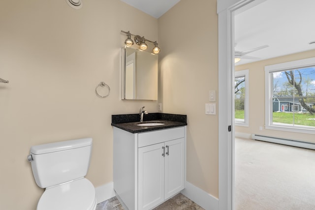 246 Coombs Rd, Brunswick, ME 04011 - bathroom with baseboards, toilet, vanity, and ceiling fan